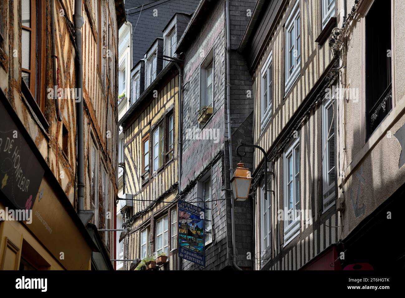 Street of Medieval half-timbered houses with a copper lantern and shop signs, Honfleur, Calvados, Basse Normandie, Normandy, France, Europe Stock Photo