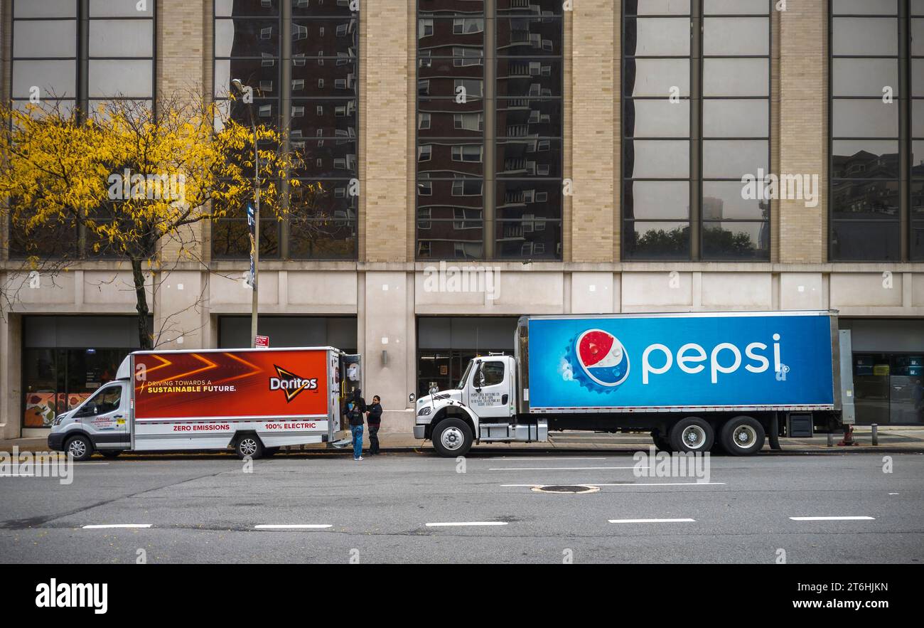 Pepsi and Doritos delivery trucks, both Pepsico products, parked in Chelsea in New York on Monday, October 30 2023. (© Richard B. Levine) Stock Photo