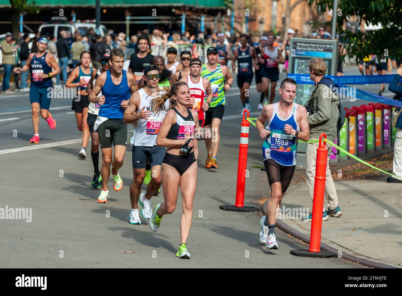 Runners pass through Harlem in New York near the 22 mile mark near Mount Morris Park on Sunday, November 5, 2023 in the running of the TCS New York City Marathon. 50,000+ participants ran through the five boroughs contending with warmish weather.  (© Richard B. Levine) Stock Photo