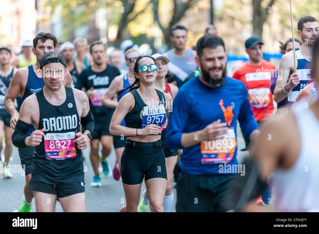 Runners pass through Harlem in New York near the 22 mile mark near Mount Morris Park on Sunday, November 5, 2023 in the running of the TCS New York City Marathon. 50,000+ participants ran through the five boroughs contending with warmish weather.  (© Richard B. Levine) Stock Photo