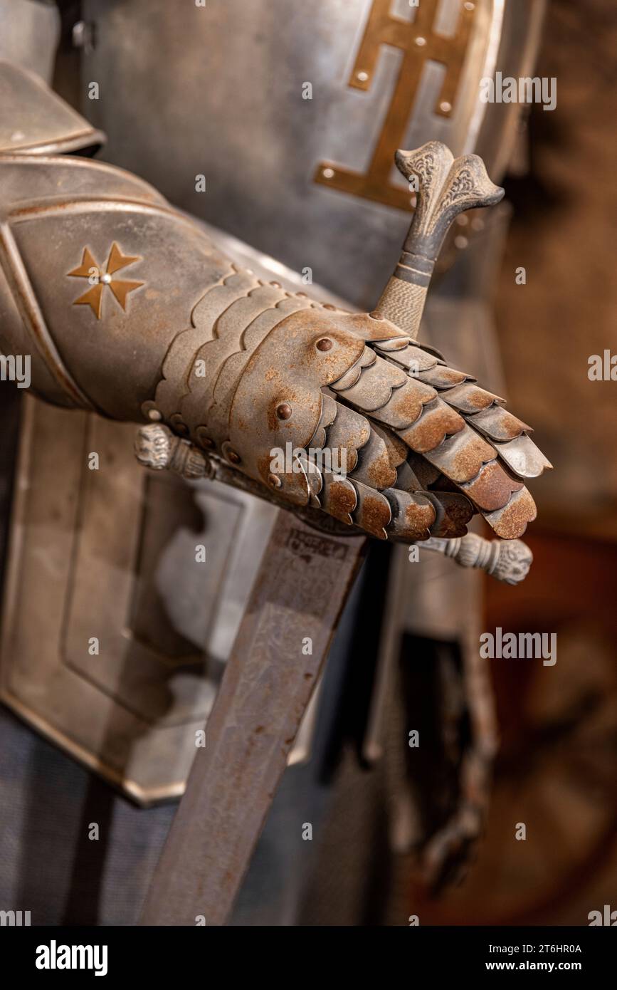 Armored glove of a medieval knight armor Stock Photo