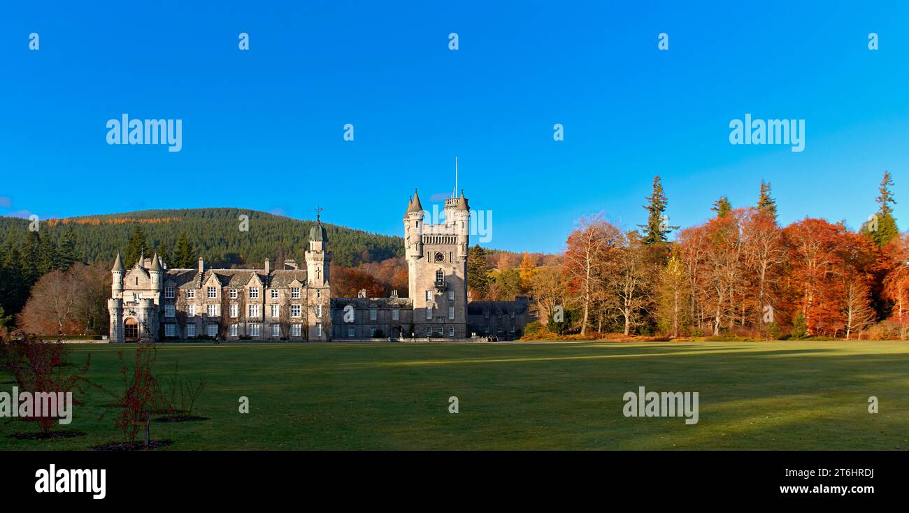 Balmoral Estates Crathie Scotland autumnal sunshine and a blue sky over the castle grounds and colourful trees Stock Photo
