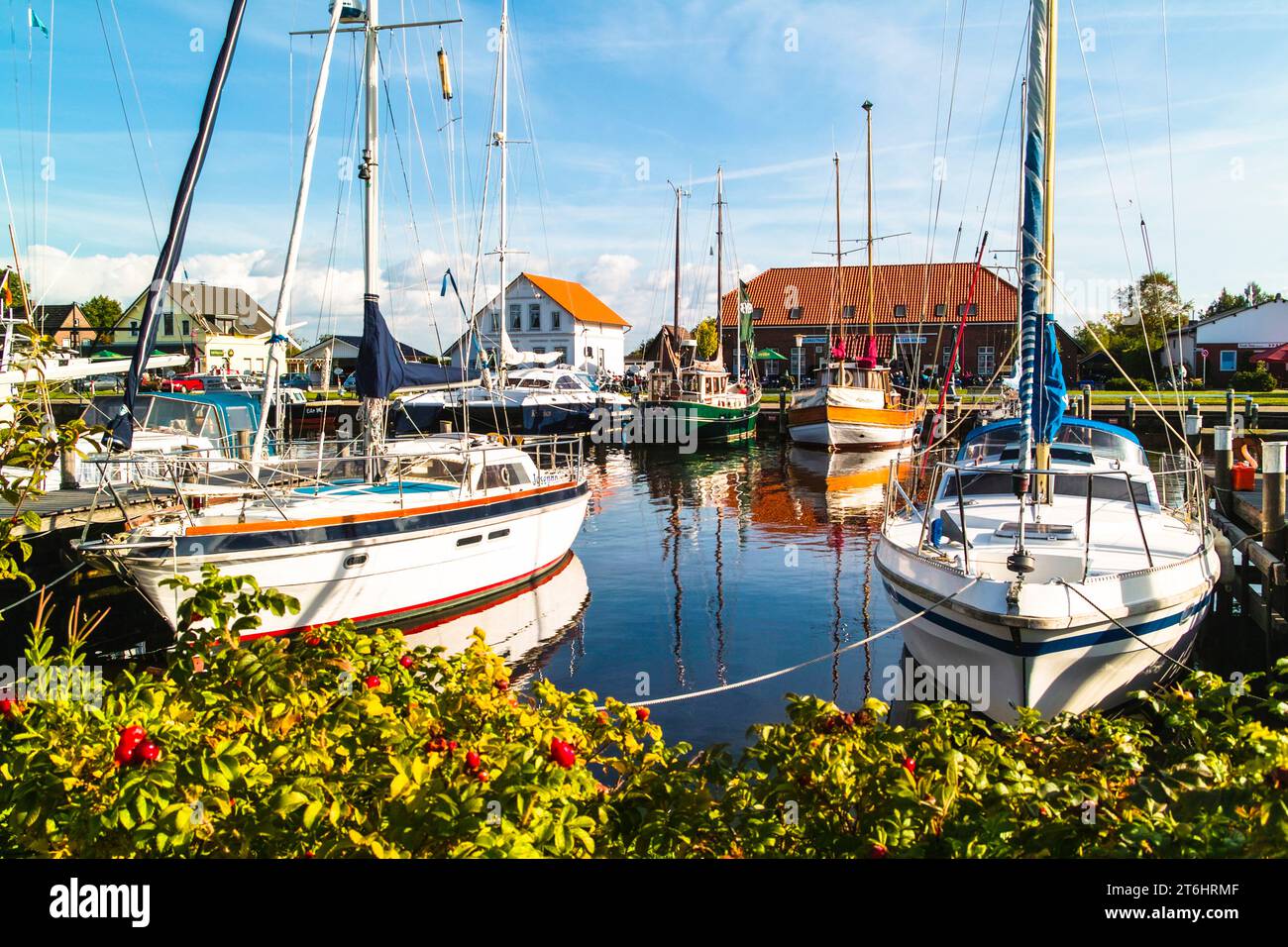 Harbor scene with sailboats and converted fishing boats in Varel inland harbor. Stock Photo