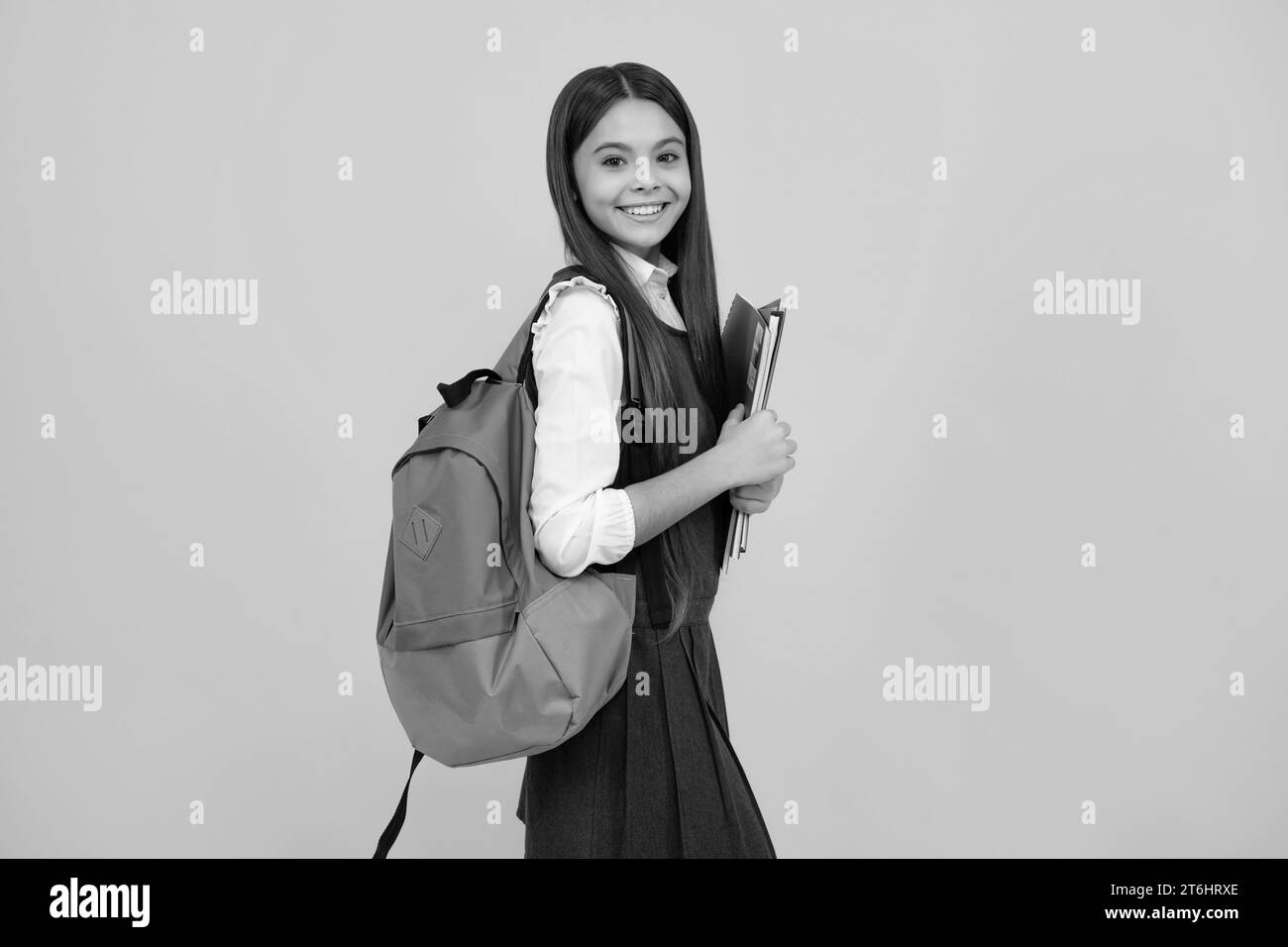 School teenager child girl 12, 13, 14 years old with school bag book