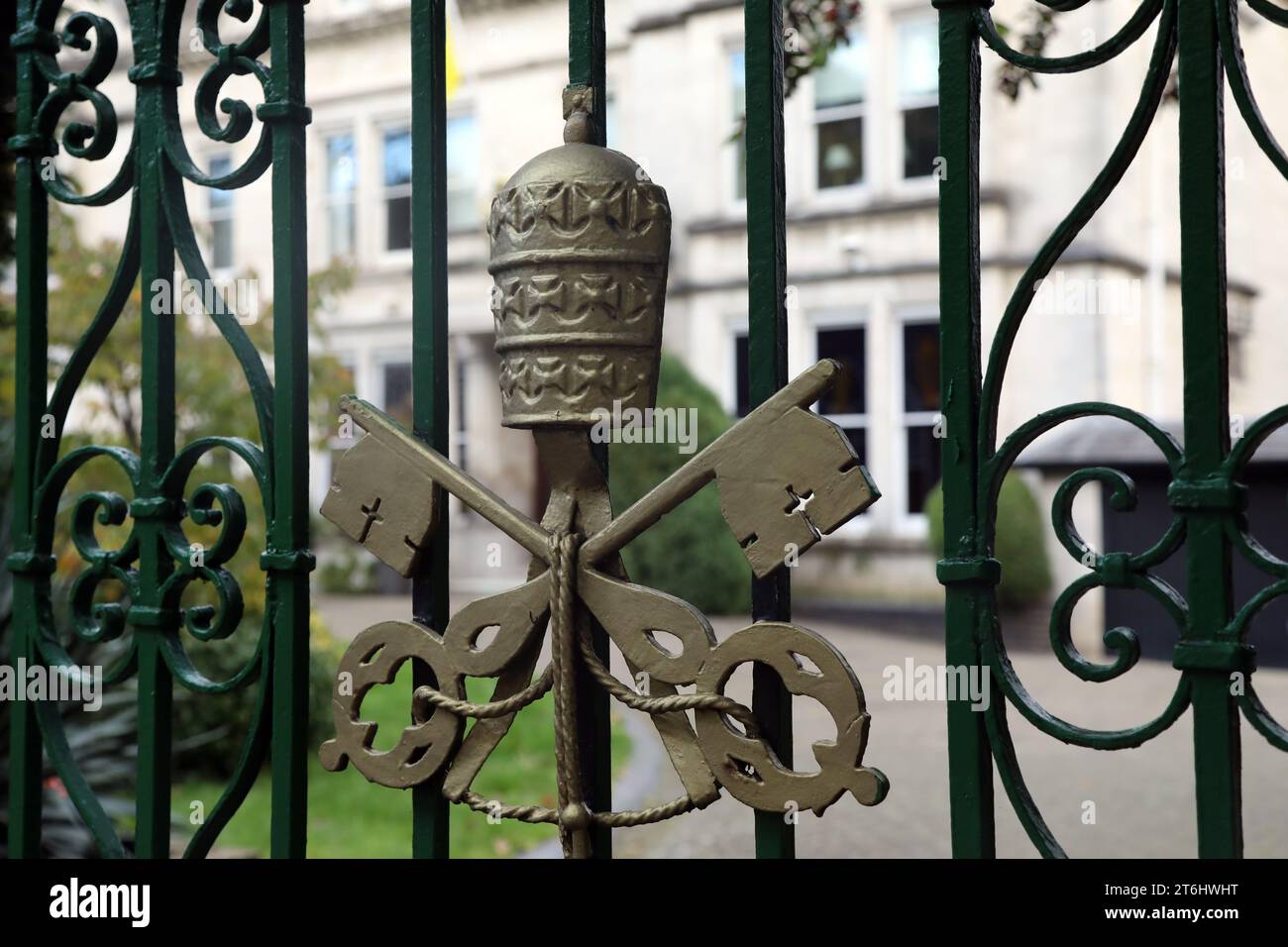The Vatican’s coat of arms, on the gate of the Vatican’s embassy in the UK – officially the Apostolic Nunciature to Great Britain, in Wimbledon, Londo Stock Photo