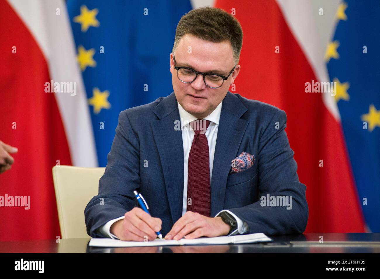 Szymon Holownia, head of the Poland 2050 party, signs the coalition agreement in the Parliament. The leaders of Polish opposition parties have signed a coalition agreement that lays out a road map for governing the nation over the next four years. The parties collectively won a majority of votes in last month's parliamentary election. Their candidate to be the next prime minister is Donald Tusk, a former prime minister who leads the largest of the opposition parties, the centrist Civic Platform. Tusk said the parties worked to seal their agreement a day before the Independence Day holiday, add Stock Photo