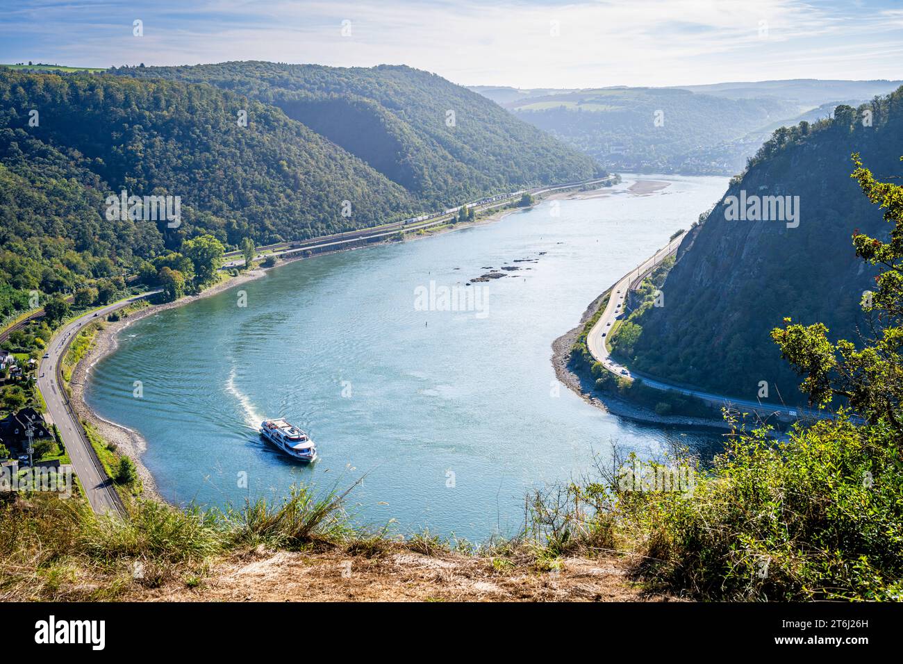 View of the Rhine towards Oberwesel from the Spitznack plateau, seen from a prominent rocky outcrop, passenger ship downstream Stock Photo