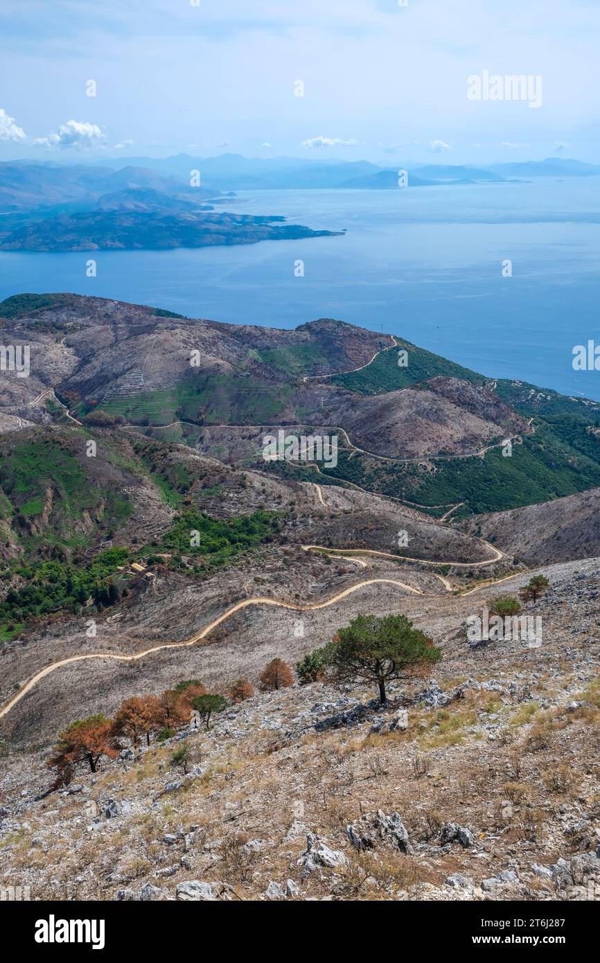 Pantokrator, Corfu, Greece, Mount Pantokrator with view over barren mountain landscape and the Ionian Sea towards mainland Albania. The Pantokrator is with about 917m the highest mountain of the island of Corfu, in the background Albania. Stock Photo