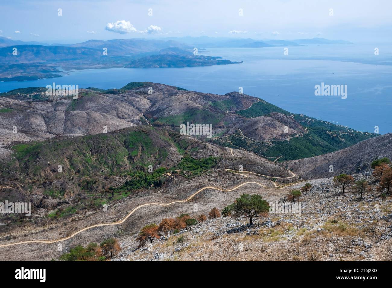 Pantokrator, Corfu, Greece, Mount Pantokrator with view over barren mountain landscape and the Ionian Sea towards mainland Albania. The Pantokrator is with about 917m the highest mountain of the island of Corfu, in the background Albania. Stock Photo