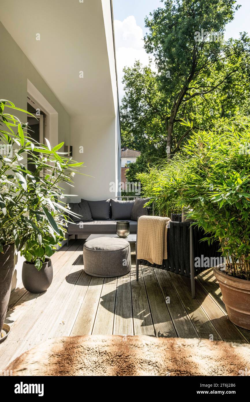 Balcony with modern lounge furniture and plants Stock Photo Alamy