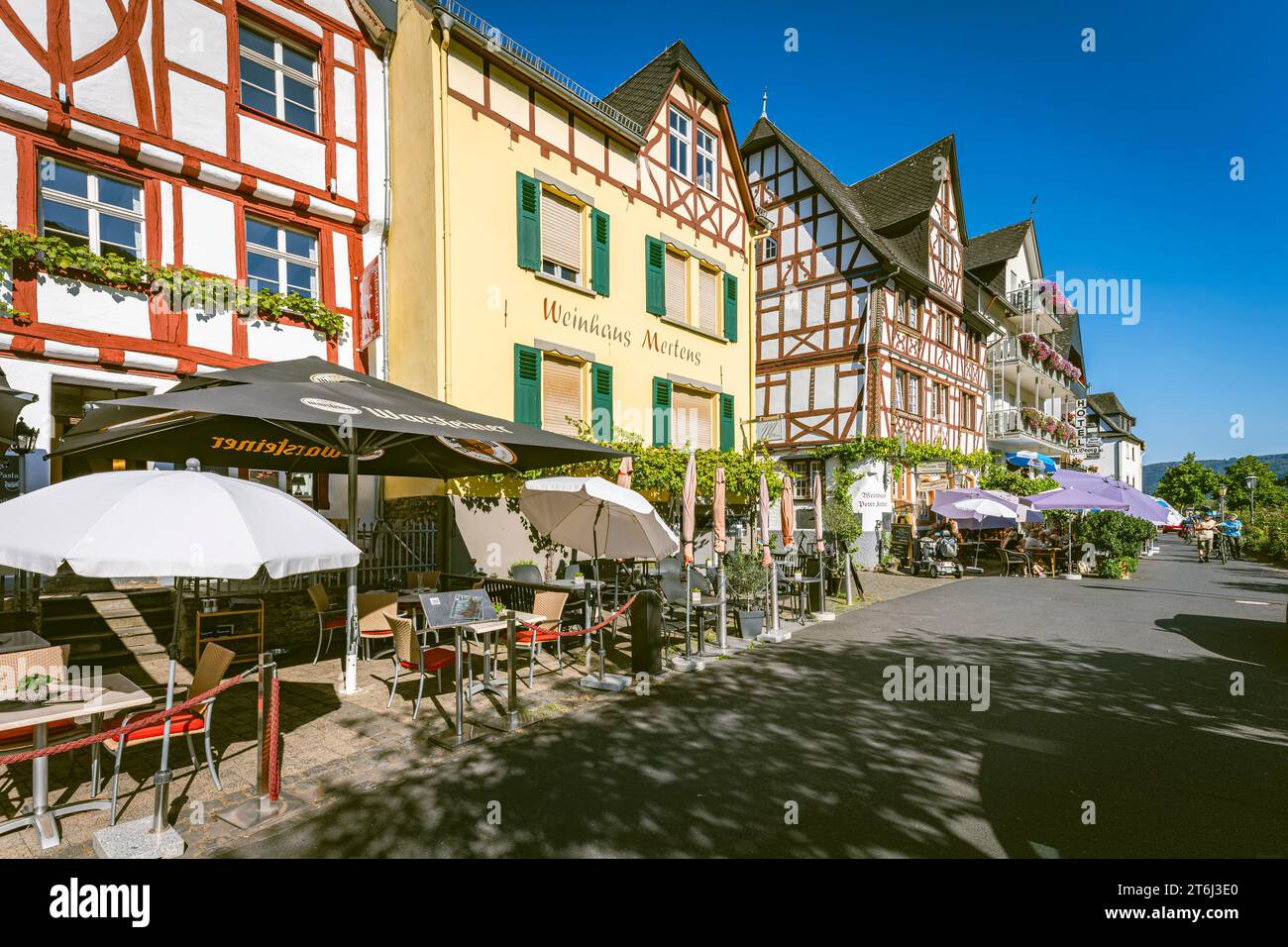 Waterfront promenade in Ediger-Eller on the Moselle, outdoor cafes, hotels and beer gardens in beautiful summer weather. Stock Photo