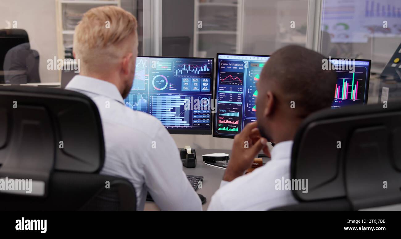 African American Data Analyst Using Data Analytics KPI Dashboard Stock Photo