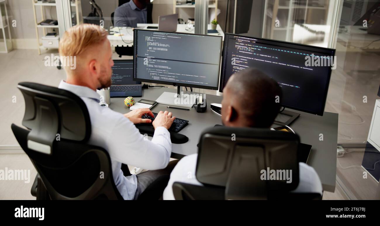 African American Programmer Man Coding On Computer Stock Photo