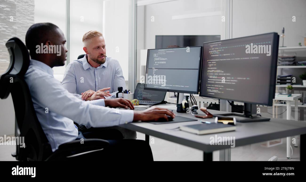 African American Programmer Man Coding On Computer Stock Photo