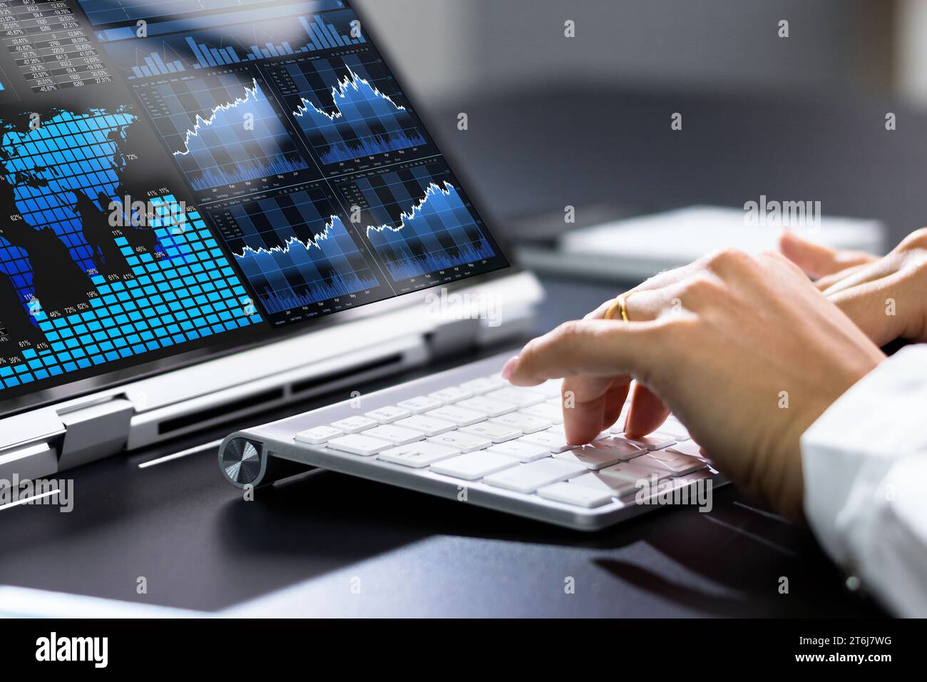 Female Analyst Analyzing KPIs on Laptop, Using Analytics and Data Stock Photo