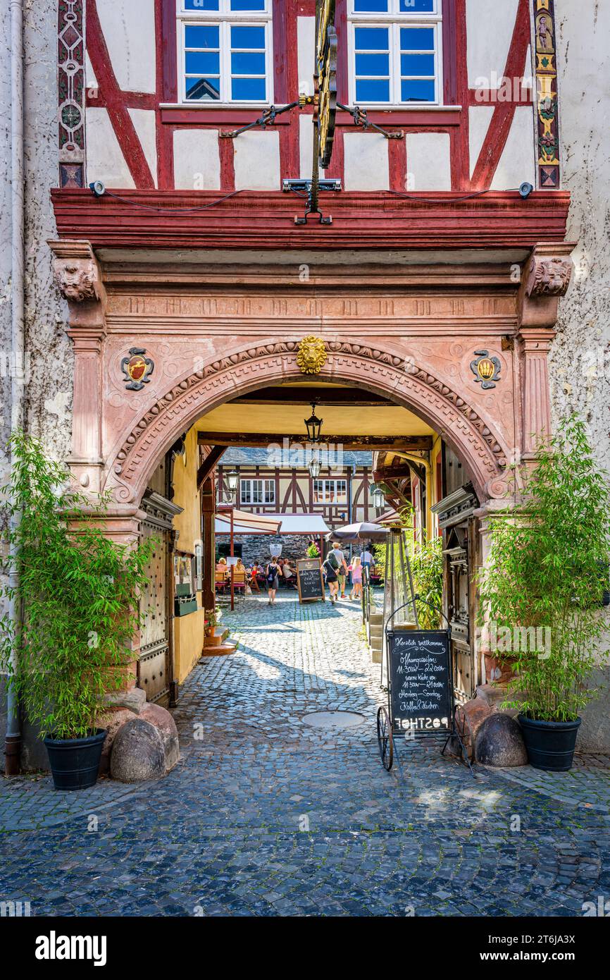 City of Bacharach on the Middle Rhine, passage to the Posthof Bacharach in Oberstrasse, historic garden pub, Stock Photo