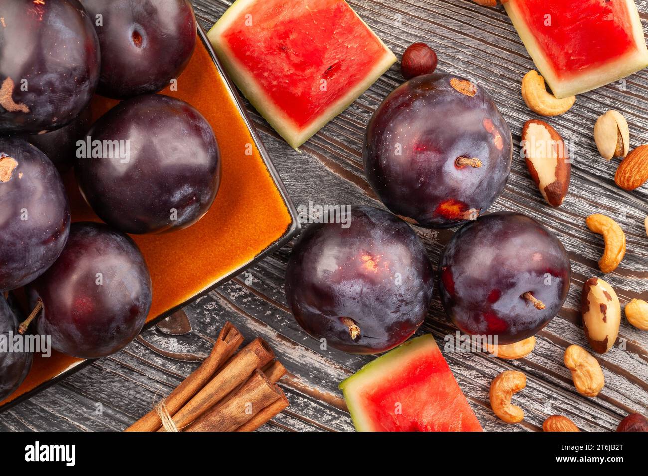 red plum on wood background Stock Photo