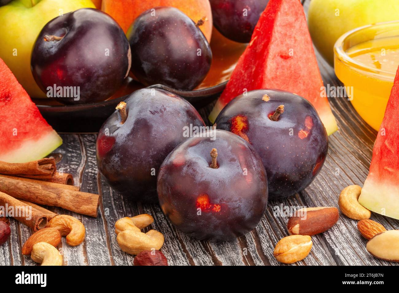 red plum on wood background Stock Photo