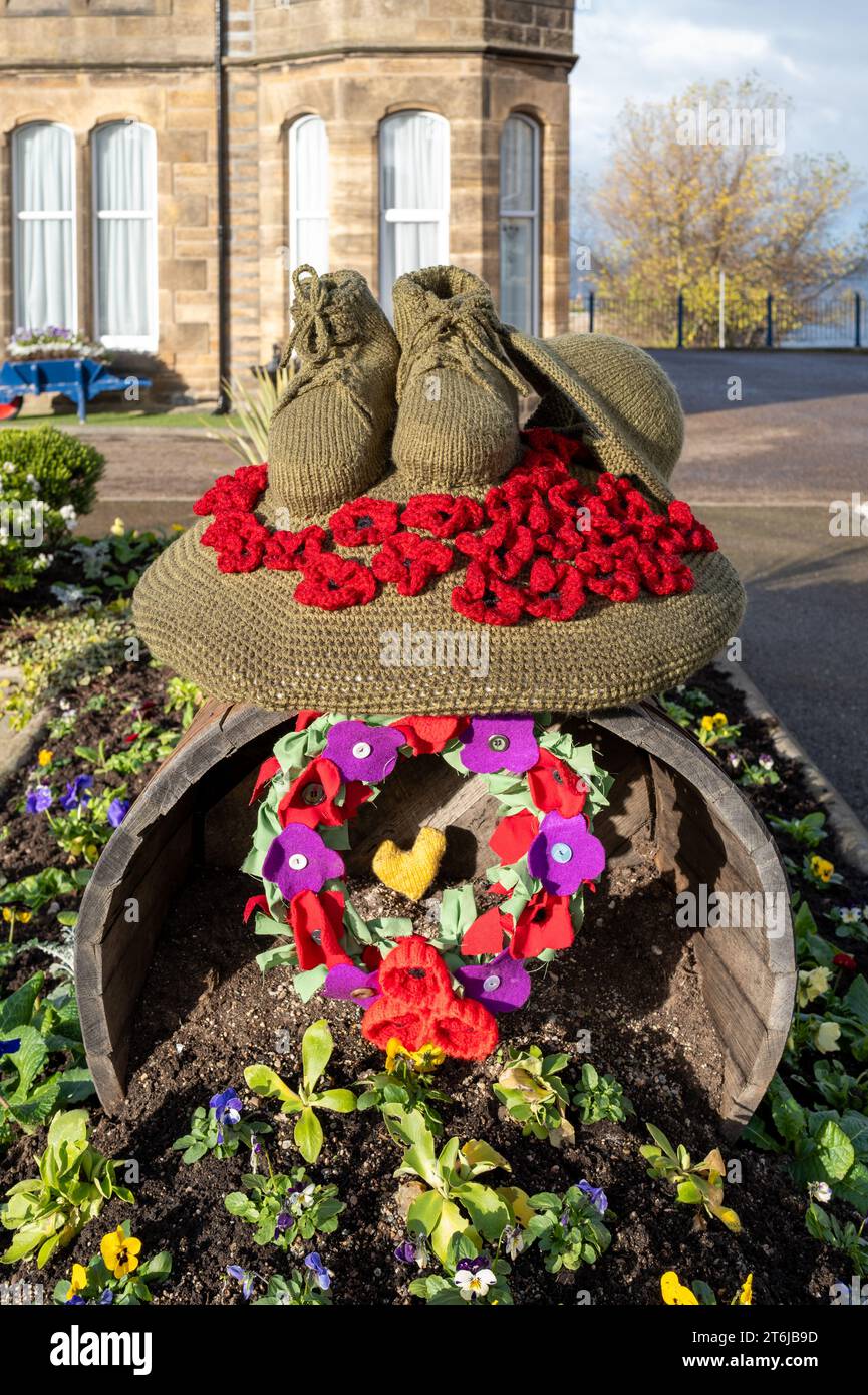 Cluny Square, Buckie, Moray, UK. 10th Nov, 2023. This is the Remembrance displays in this bustling town, with Red Poppies, Soldiers Hat and Boots and a large Cross with poppies to remember Soldiers, Horses, Dogs and other animals lost in the wars. Credit: JASPERIMAGE/Alamy Live News Stock Photo
