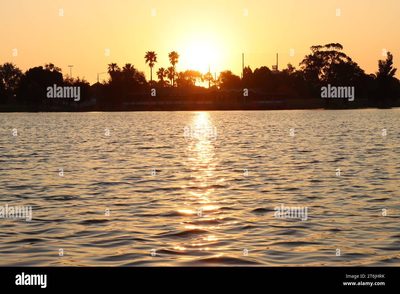 Sun setting over the lake Stock Photo