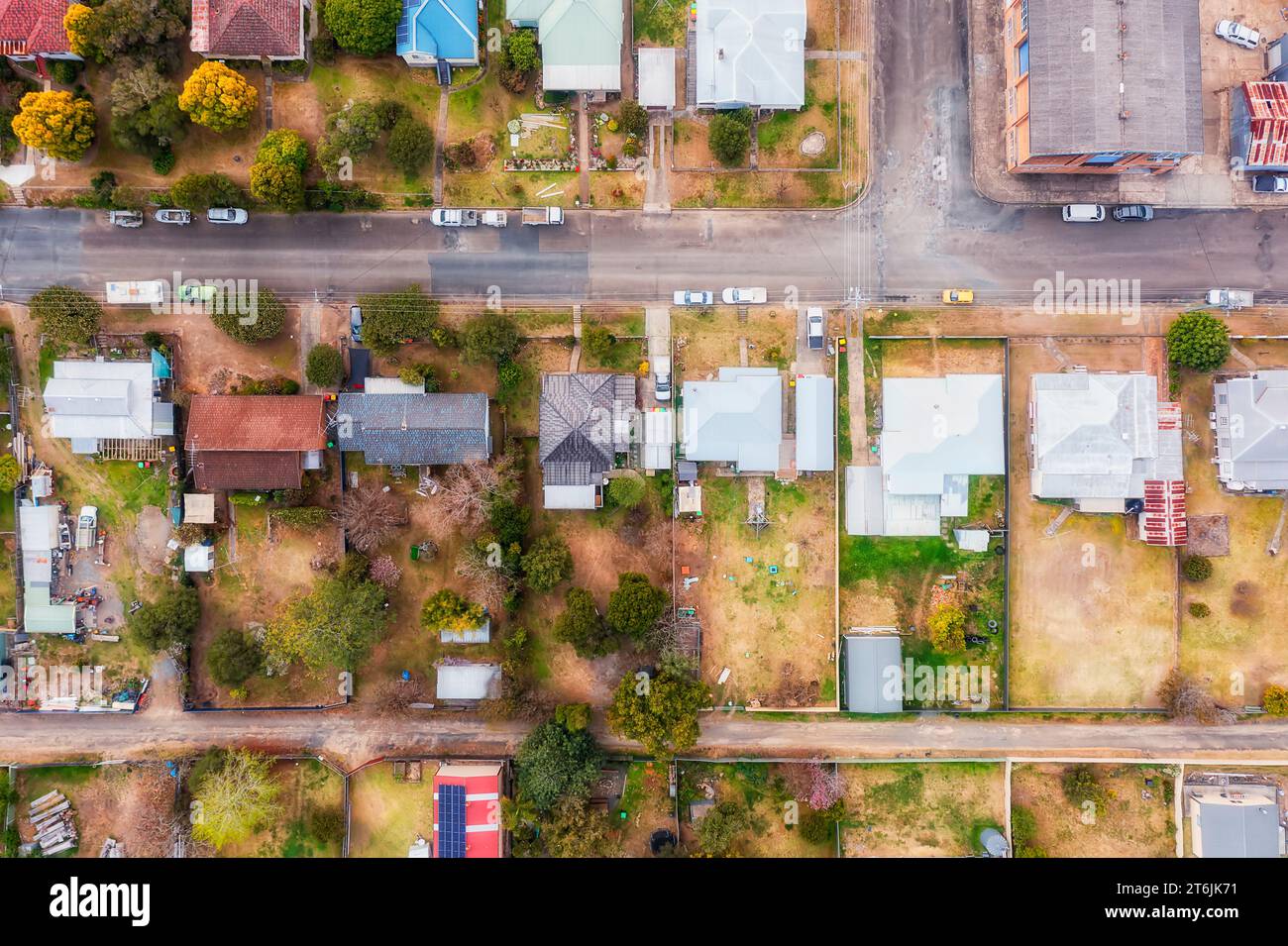 Typical regional residential street in remote agriculture town Gloucester in Australia - top down aerial view over houses and dwellings. Stock Photo