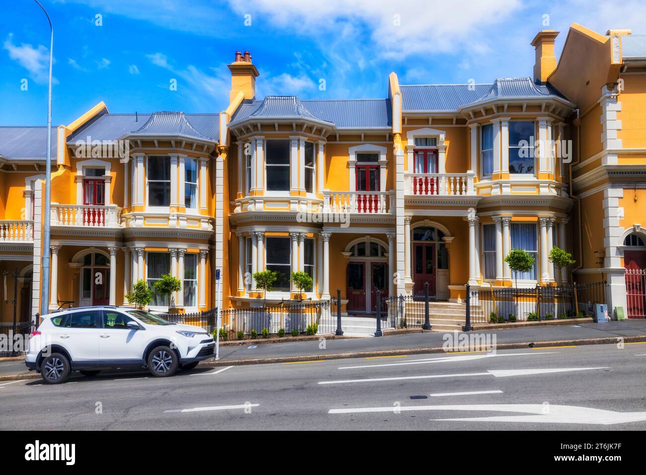 Facade of historic multi apartment building complex in downtown of Dunedin city of New Zealand. Stock Photo