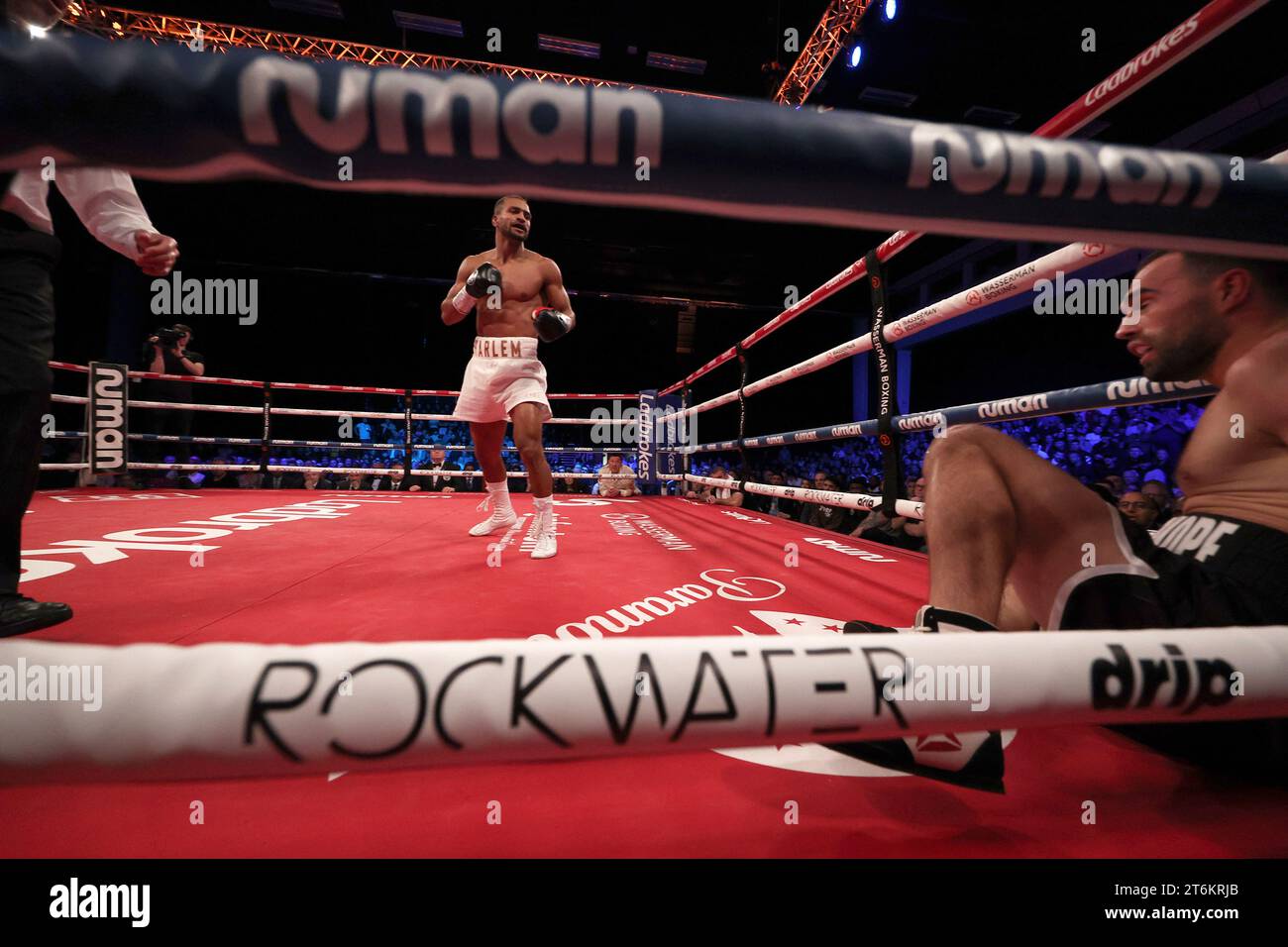 Brighton, UK 10th November, 2023 : Harlem Eubank stands over Timo Schwarzkopf after knocking him to the ground during there super lightweight fight at the Brighton Centre. Credit: James Boardman/Alamy Live News Stock Photo
