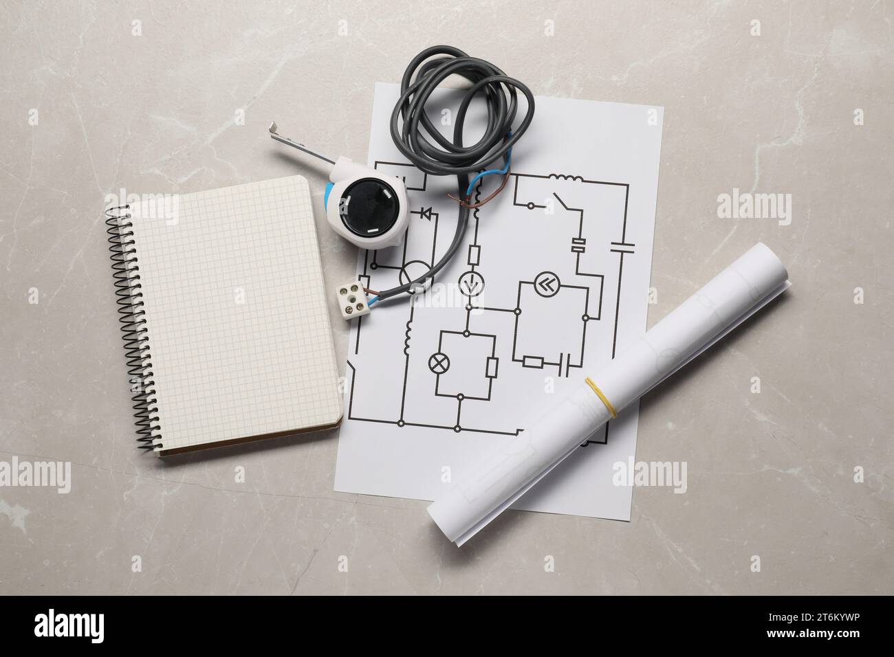 Wiring diagram, wires, tape measure and notepad on light table, flat lay Stock Photo