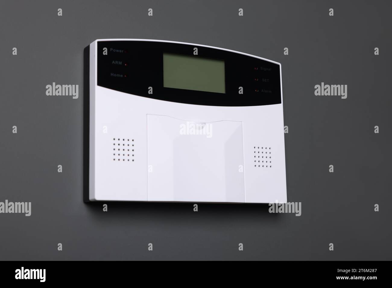 Home security alarm system on gray wall Stock Photo - Alamy