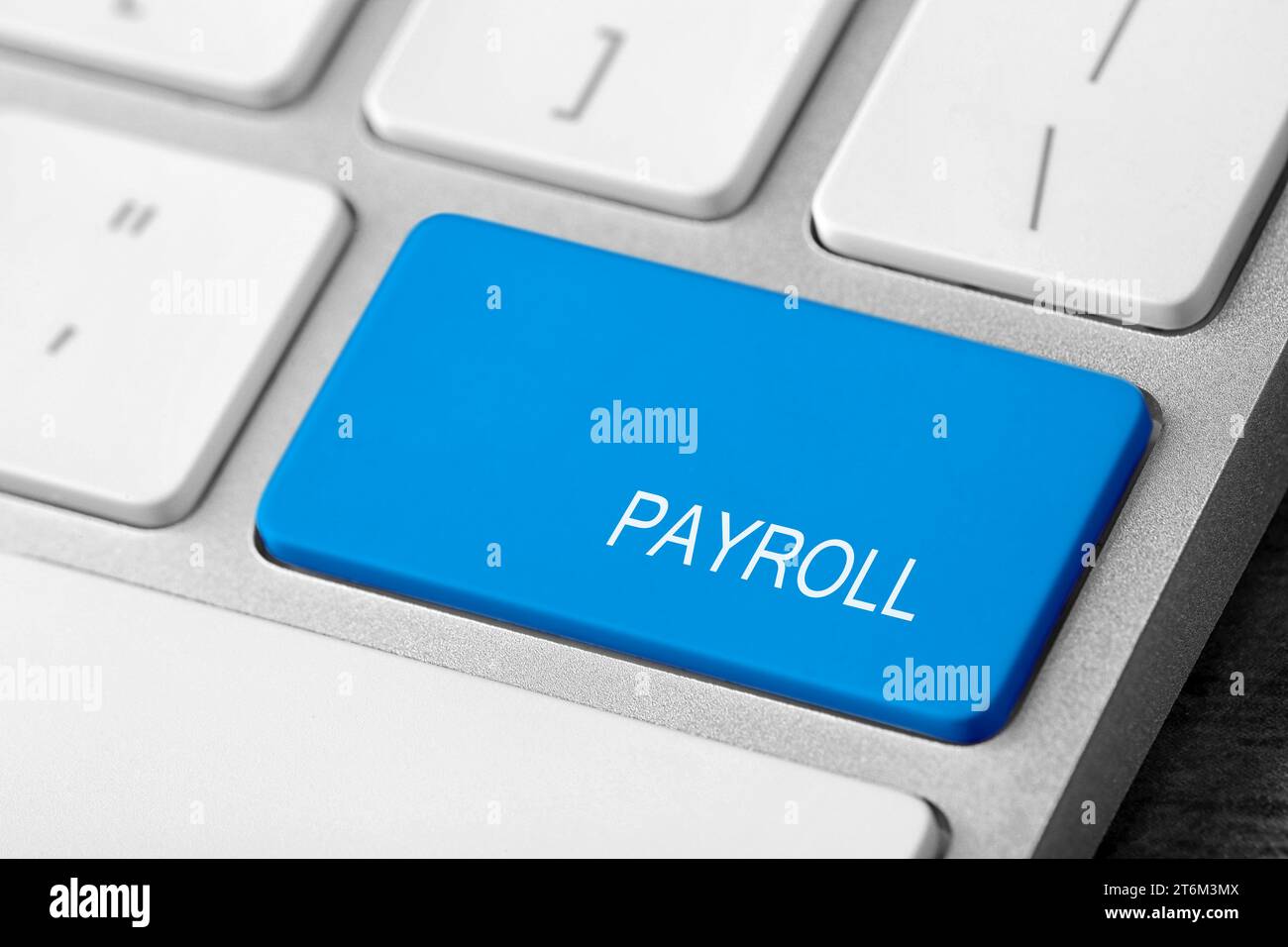 Light blue button with word Payroll on keyboard, closeup Stock Photo