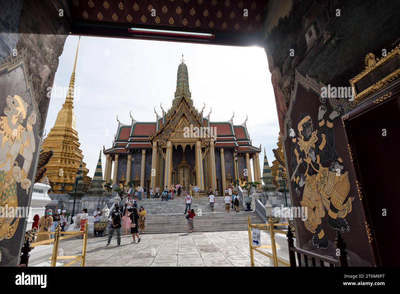 Bangkok, Thailand - Jun 1, 2019: Visitors crowd in Prasat Phra Dhepbidorn or The Royal Pantheon, Grand Palace, Bangkok, Thailand - The Royal Pantheon Stock Photo
