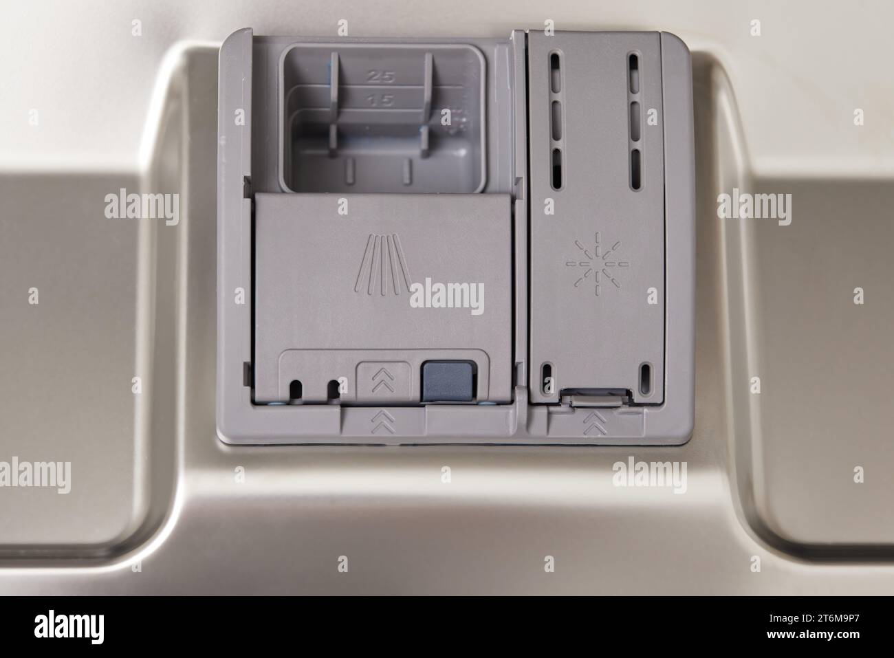 Dishwasher compartments for detergents, capsules and liquids. closeup Stock Photo Alamy