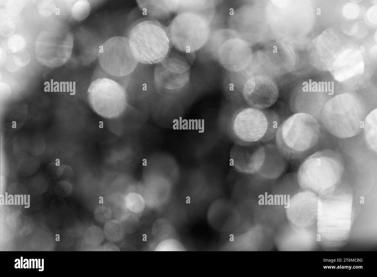 Glitter bokeh black background for use as a texture layer in your project. Stock Photo