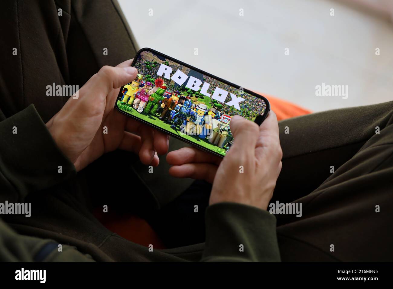 Roblox mobile iOS game on iPhone 15 smartphone screen in male hands during  mobile gameplay. Mobile gaming and entertainment on portable device Stock  Photo - Alamy