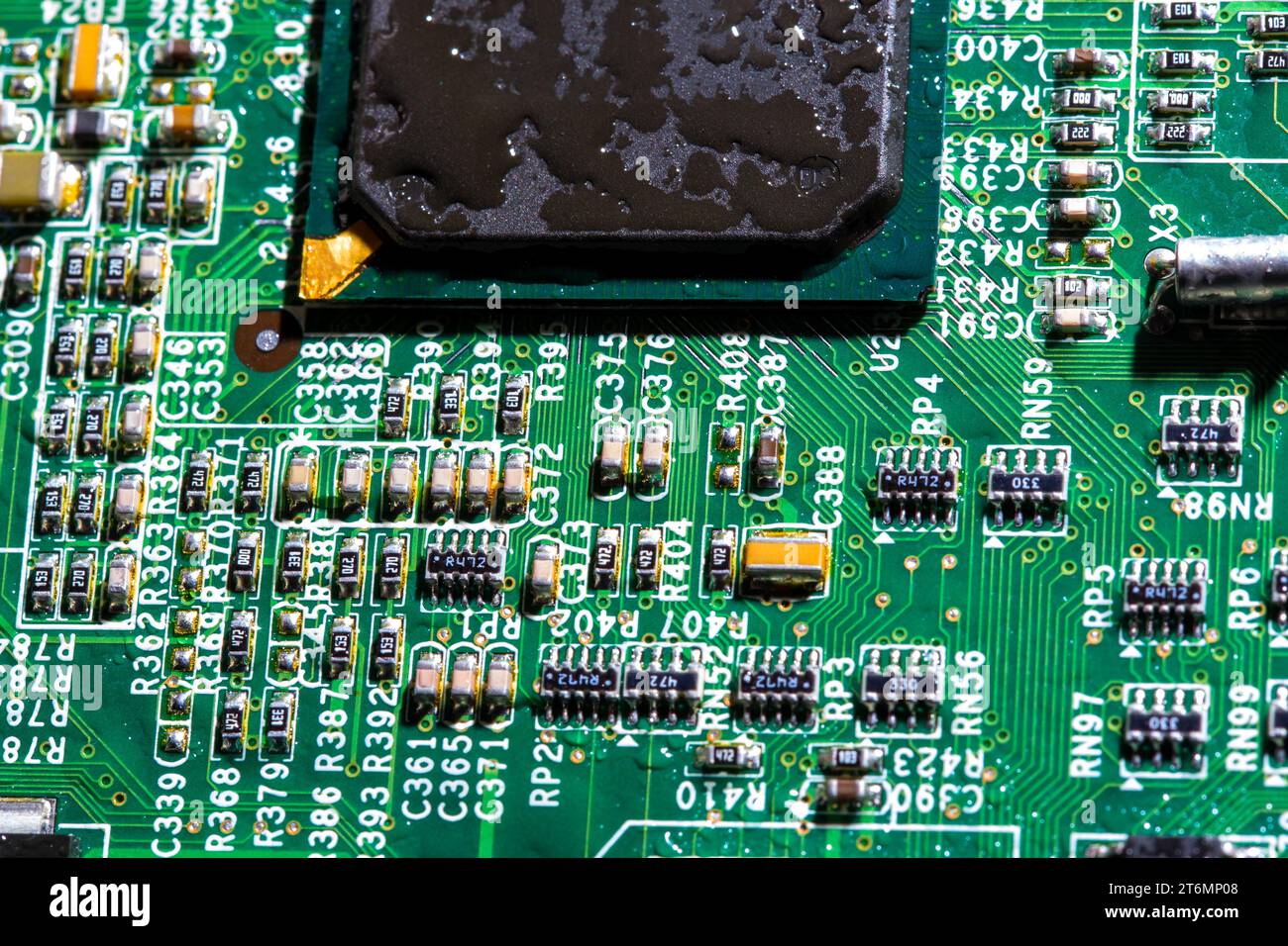 wet digital circuit board with microprocessors and components, closeup