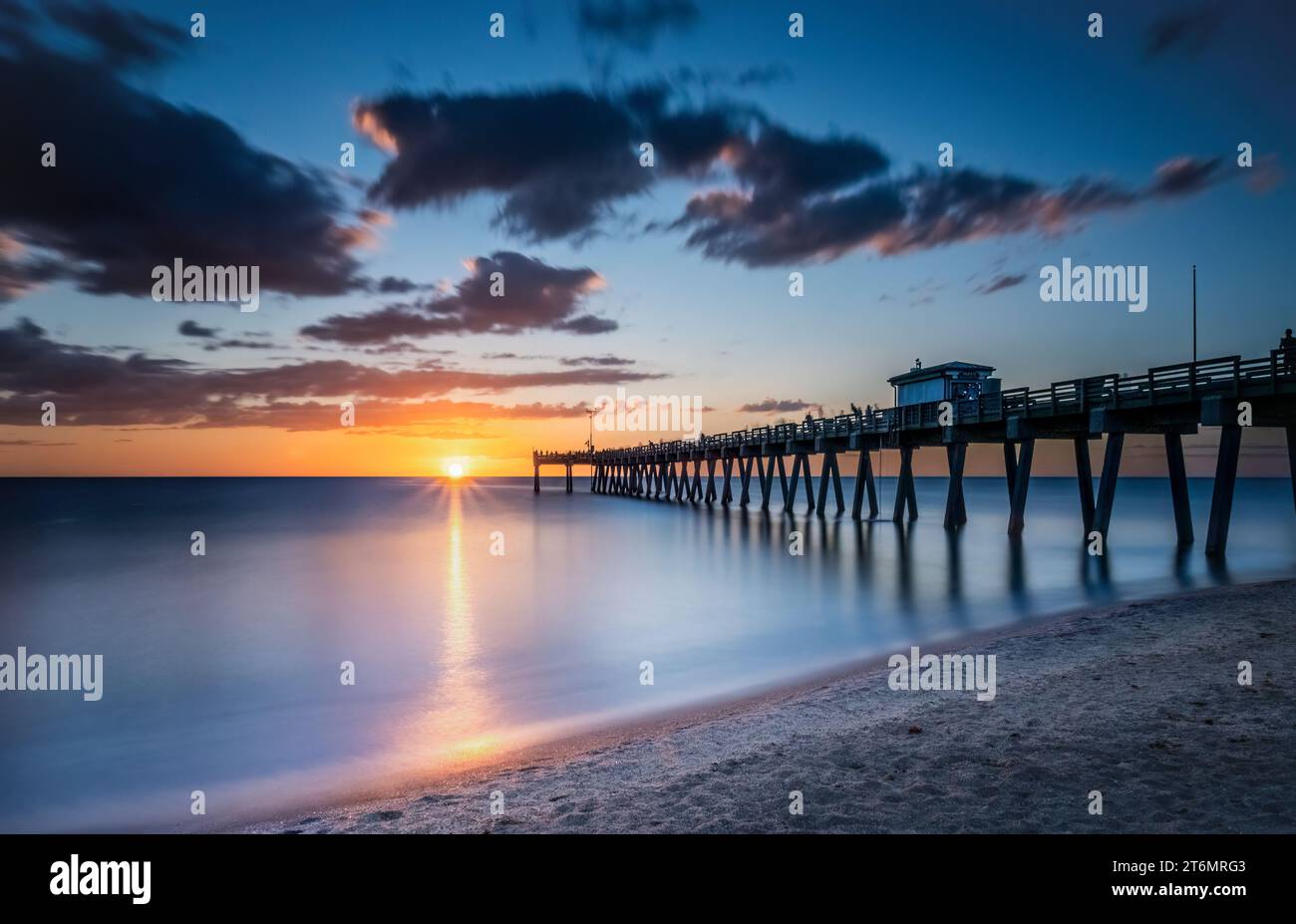 Sunset sky over the Gulf of Mexico at the Venice Fishing Pier in Venice Florida USA Stock Photo