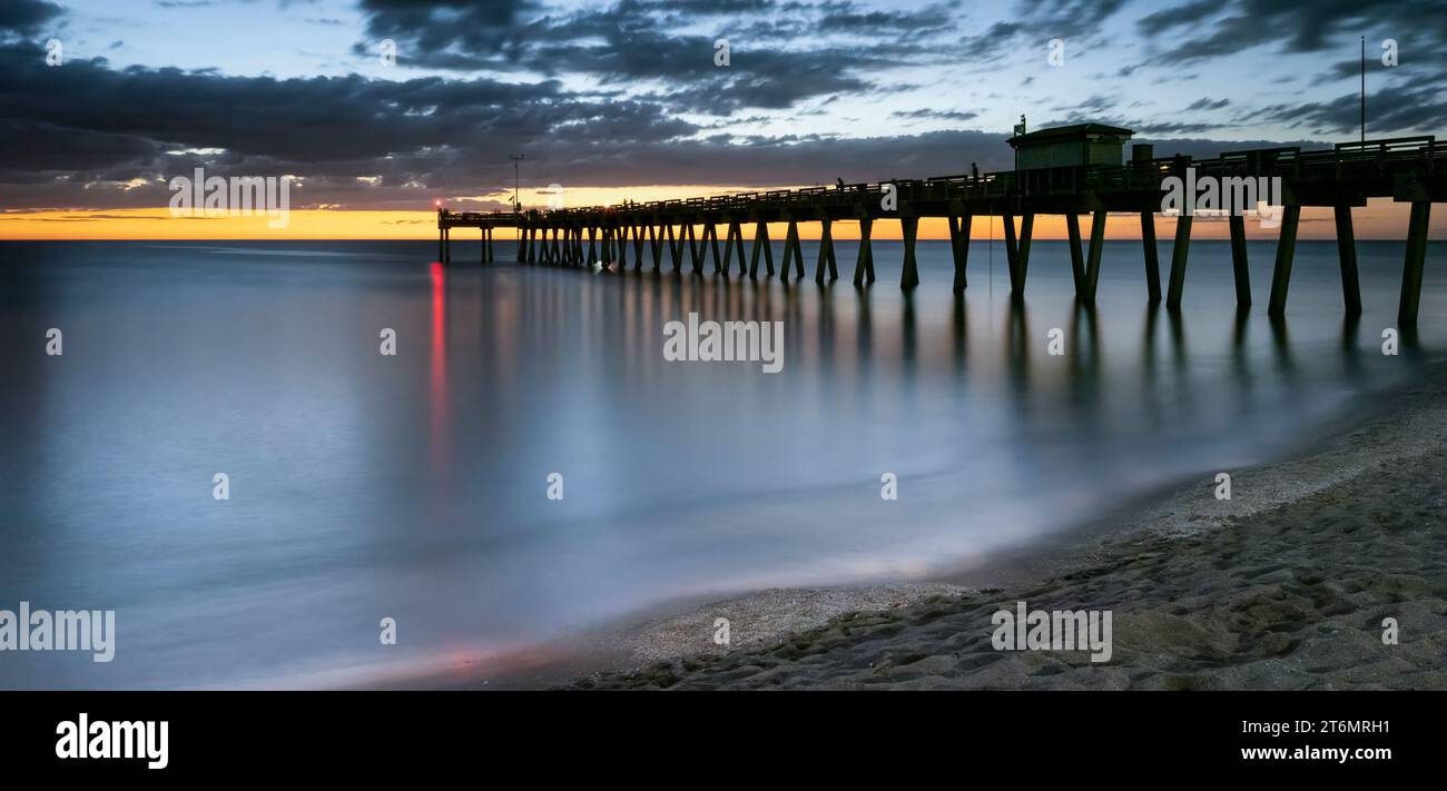 Sunset sky over the Gulf of Mexico at the Venice Fishing Pier in Venice Florida USA Stock Photo