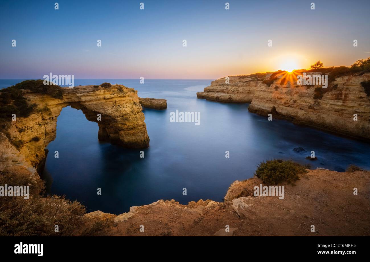 The rock arch known as Arco de Albandeira at Albandeira beach or Praia De Albandeira on the southern Algarve coast of Portugal Stock Photo