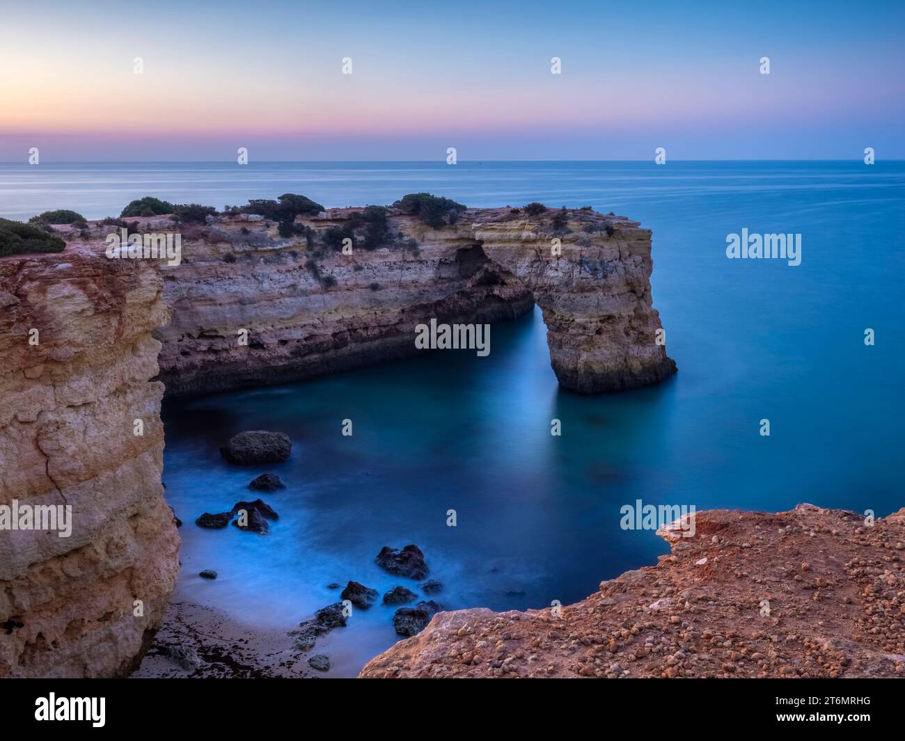 The rock arch known as Arco de Albandeira at Albandeira beach or Praia De Albandeira on the southern Algarve coast of Portugal Stock Photo