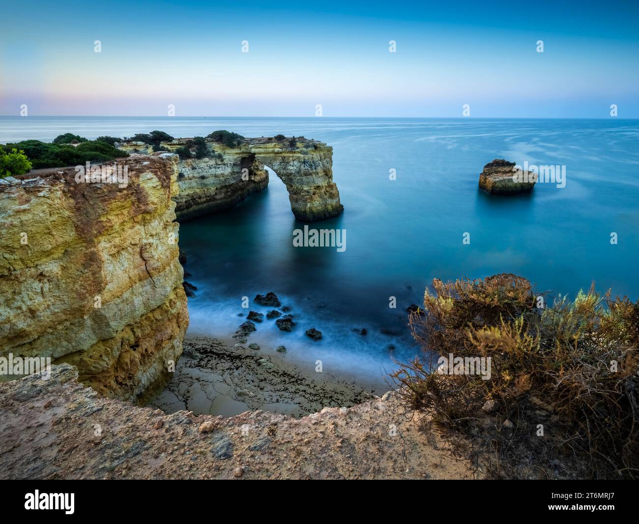 The rock arch known as Arco de Albandeira at Albandeira beach or Praia De Albandeira on the southern Algarve coast of Portugal Stock Photo