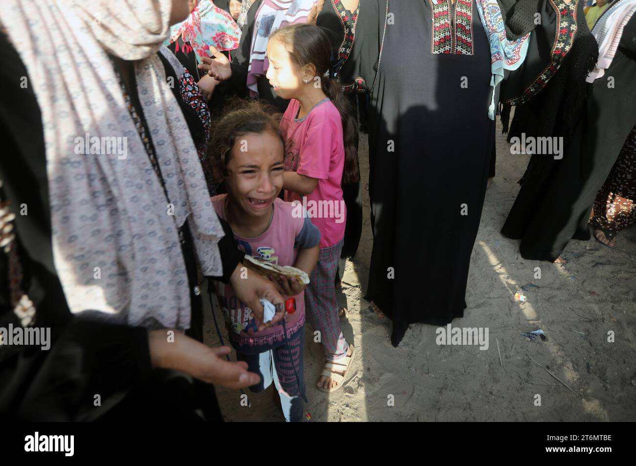 A Palestinian child reacts during the funeral of the Faojo family