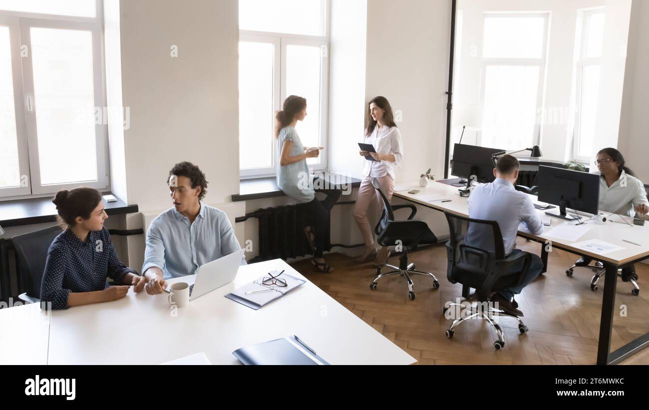 Multiethnic business team working in small office space Stock Photo