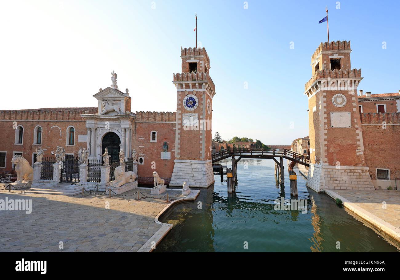 Entrance to the Venetian Arsenal with its permanent guard of marble lions.  The Venetian Arsenal is a complex of former shipyards and armories cluster Stock Photo