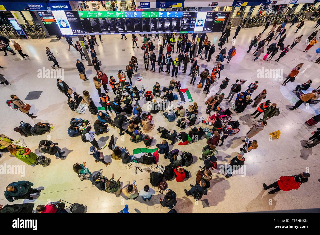 London, UK. 11 Nov 2023. A small splinter group stage a brief sit in at ...