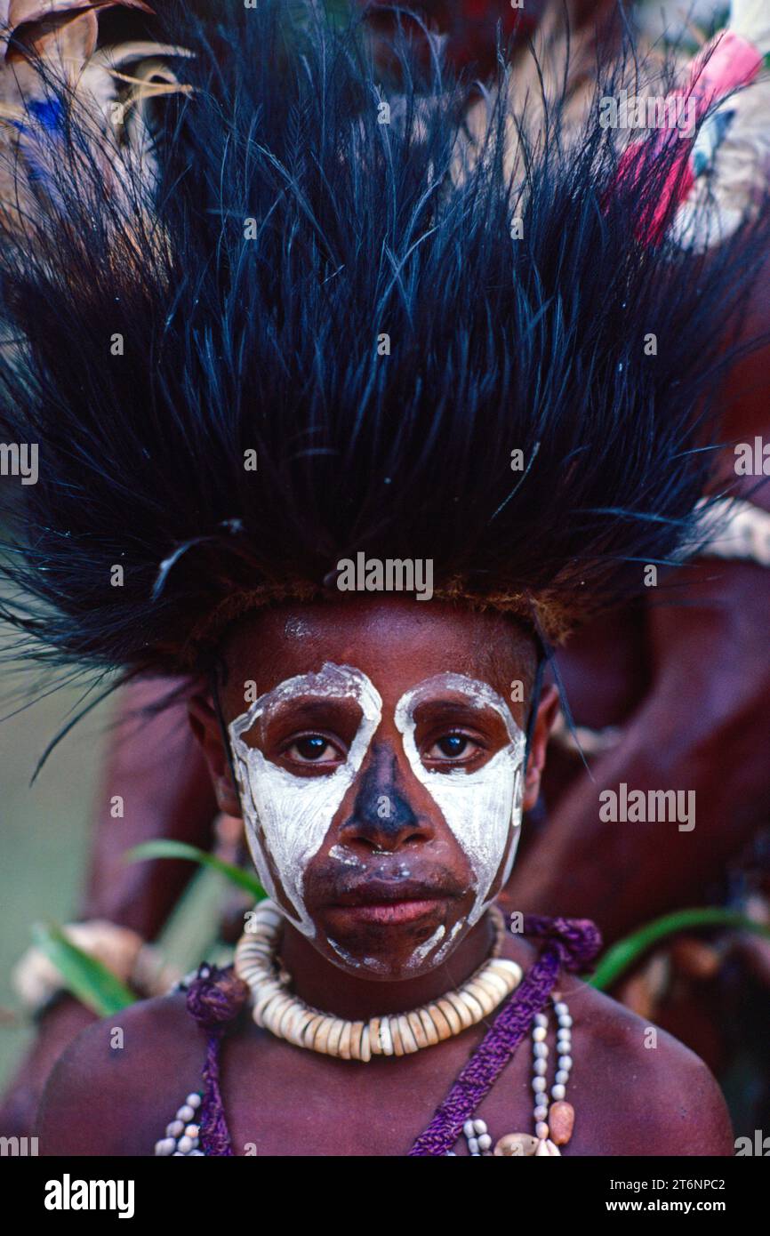Papua New Guinea. East Sepik. Outdoor portrait of local child with tribal headdress. Stock Photo