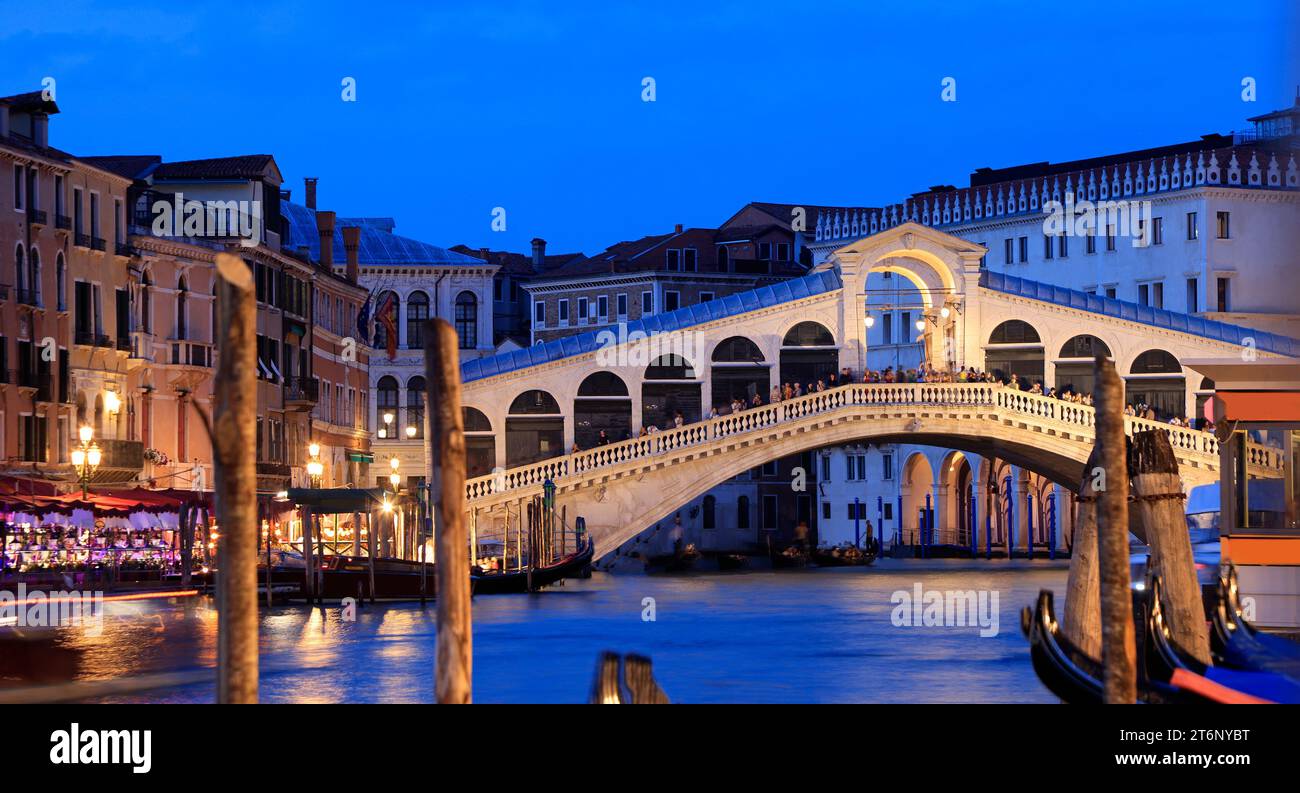 Rialto Bridge  illuminated at dusk in Venice, Italy Stock Photo