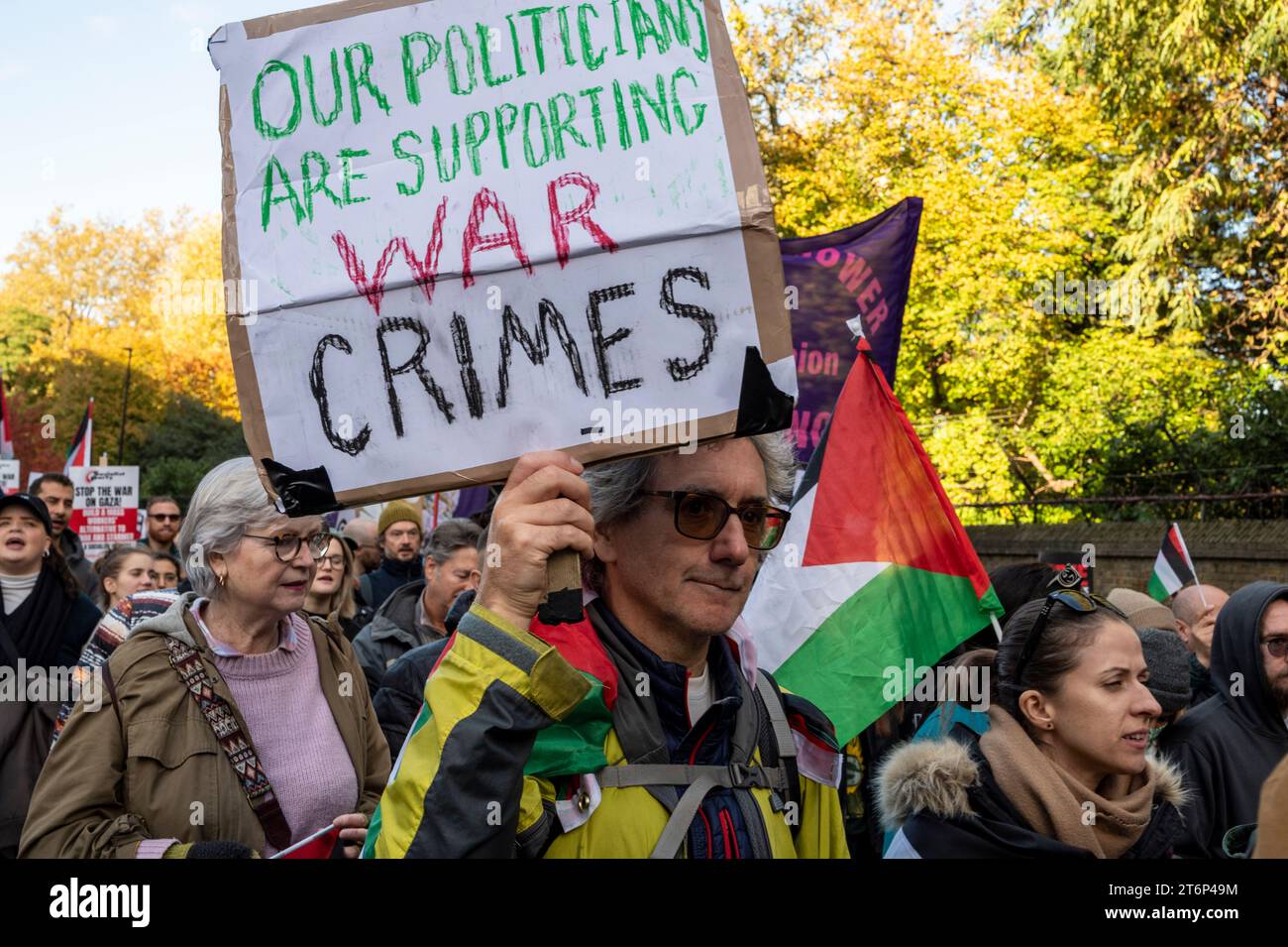 Protesters against the bombing of Gaza with placard "Our politicians are supporting war crimes". London Stock Photo