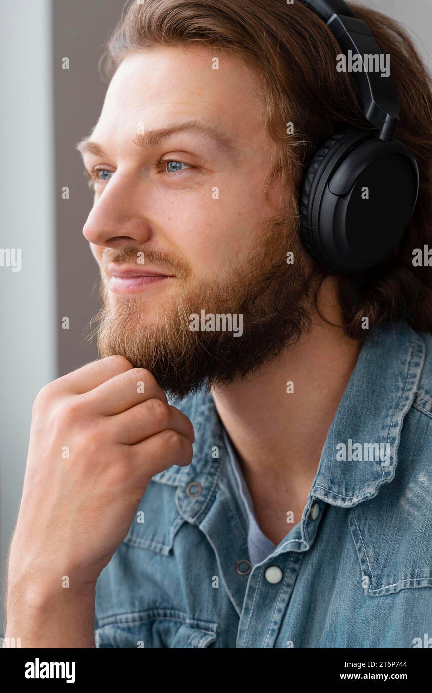 Close up smiley man with headphones Stock Photo