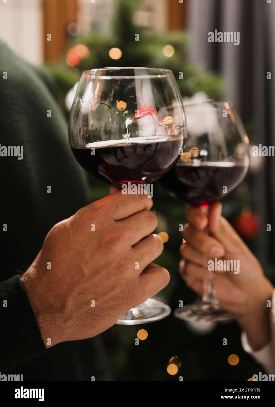 Couple cheering glasses wine Stock Photo Alamy