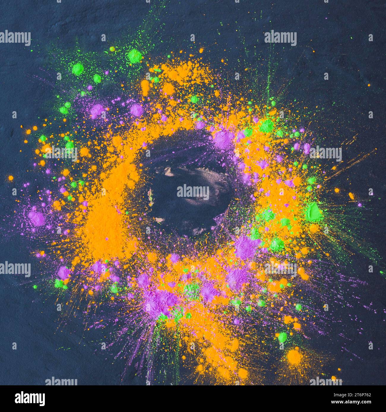 Colourful powder scattered dark table Stock Photo